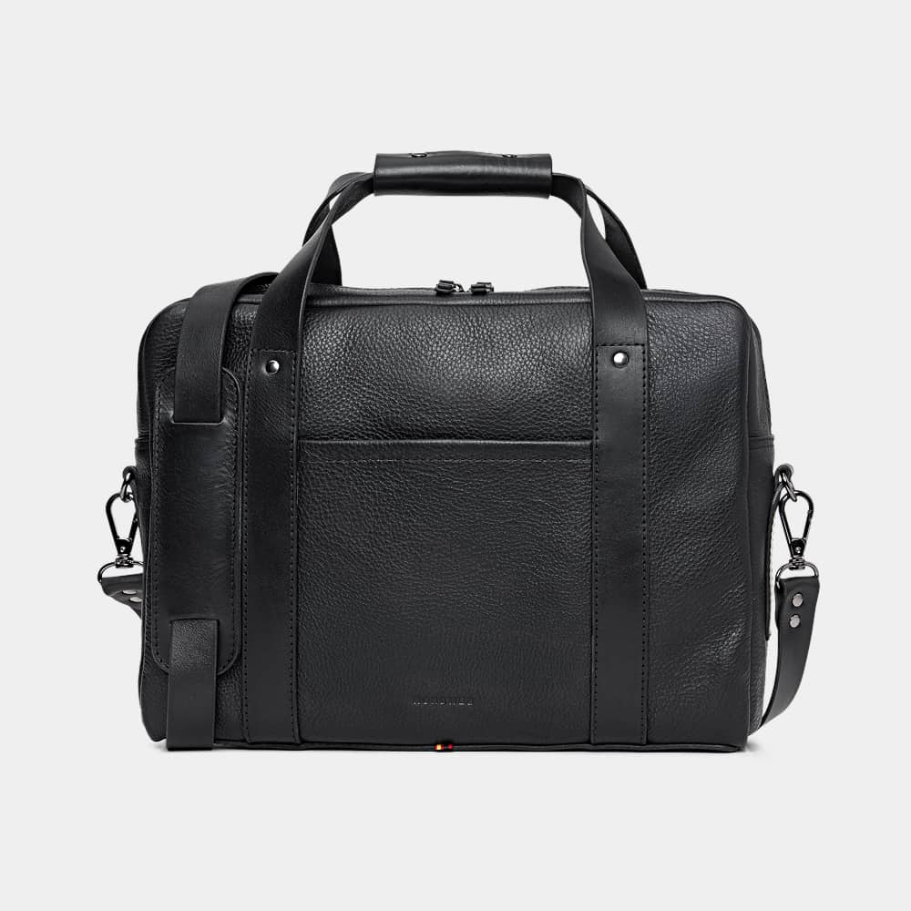 A single green leaf against a white background.