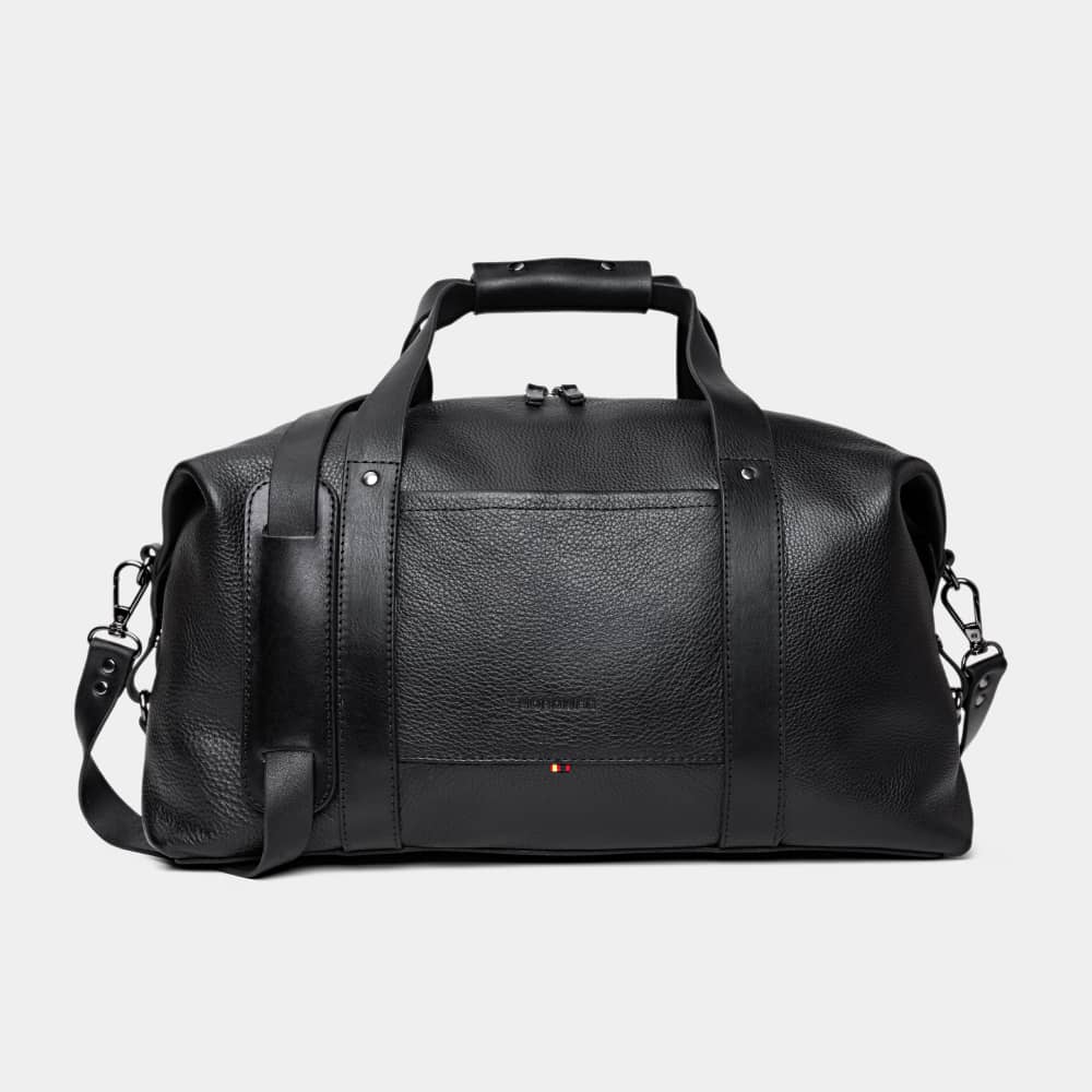 A single green leaf against a white background.