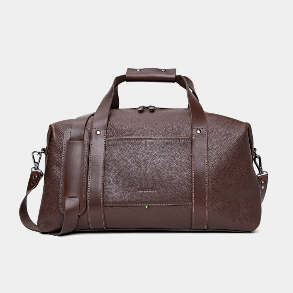 A single green leaf against a white background.